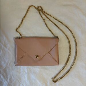 Forever 21 small pink envelope crossbody purse with gold chain.